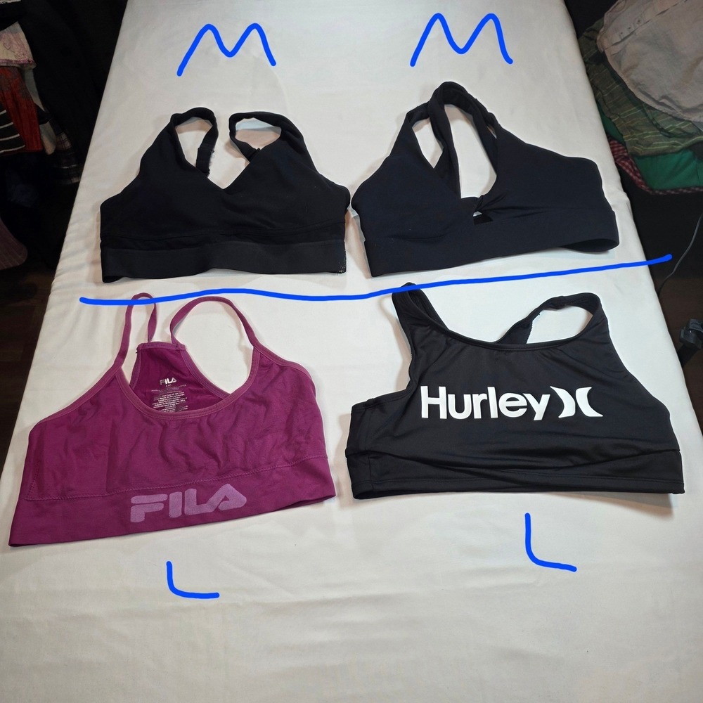 women's sports bras 2 large bottom of picture and 2 medium at the top of picture
